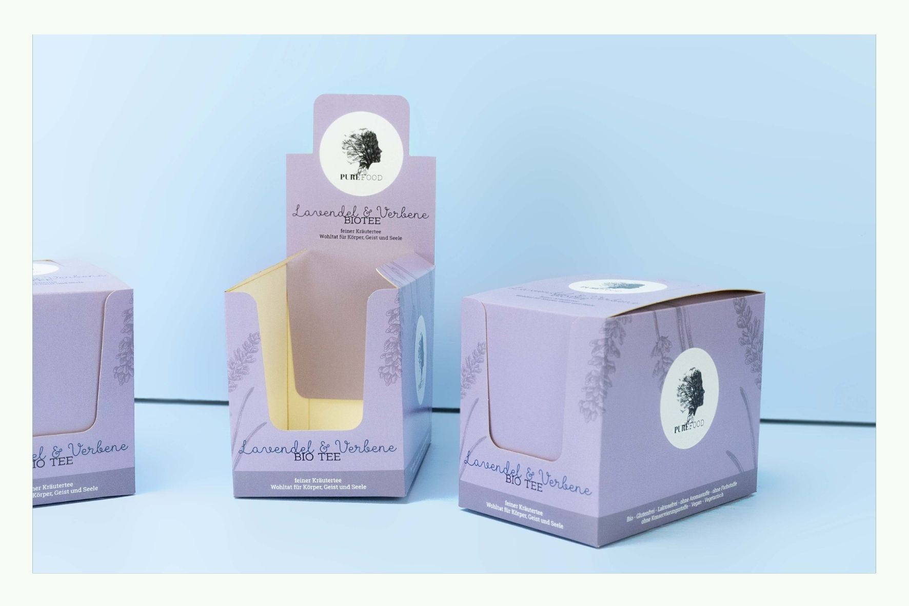 Mehrere rosa Thekendisplays aus Karton, eines davon geöffnet